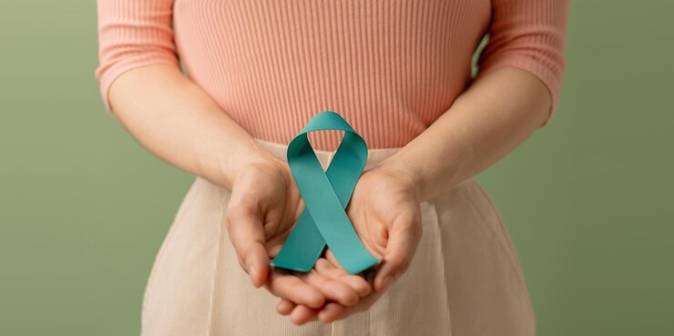 Ovarian and Cervical Cancer Awareness Woman Holding Teal Ribbon on Lower Abdomen Uterus Female Reproductive System Women's Health PCOS and Gynecology