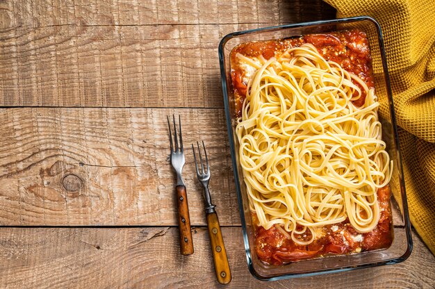 Oven baked feta Spaghetti pasta in baking dish.