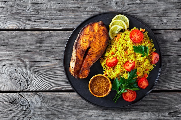 Oven baked salmon steak with yellow rice