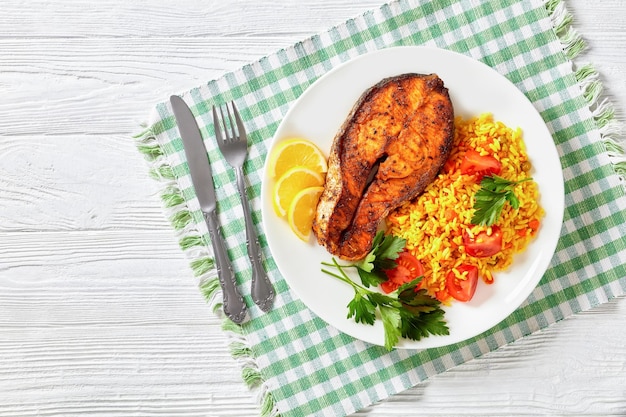 Oven baked salmon steak with yellow rice