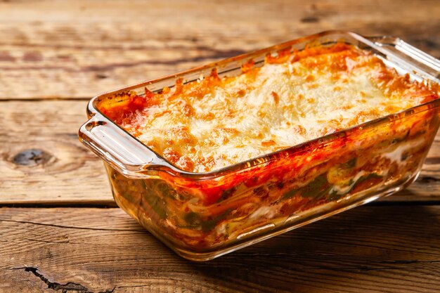 Oven Baked Vegetarian Lasagna served in dish isolated on table top view of arabic tasty fasfood