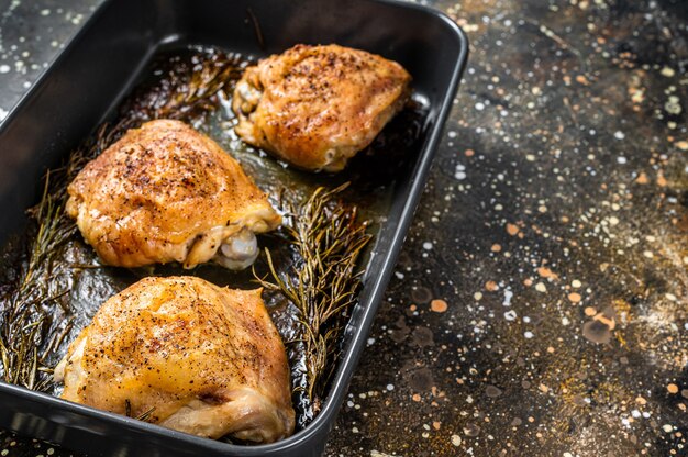 Oven Roasted chicken thighs with spices in baking dish