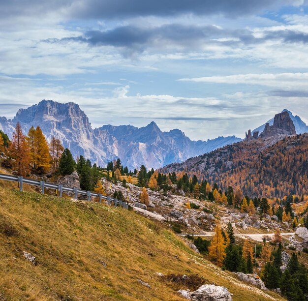 Overcast morning autumn alpine Dolomites mountain scene Peaceful view near Valparola and Falzarego Path Belluno Italy