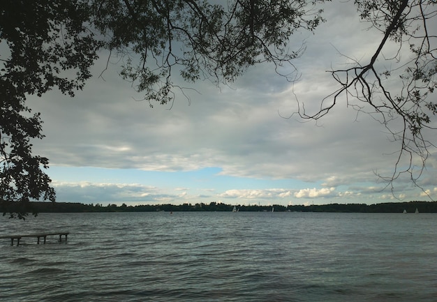 Overcast weather on river beach background