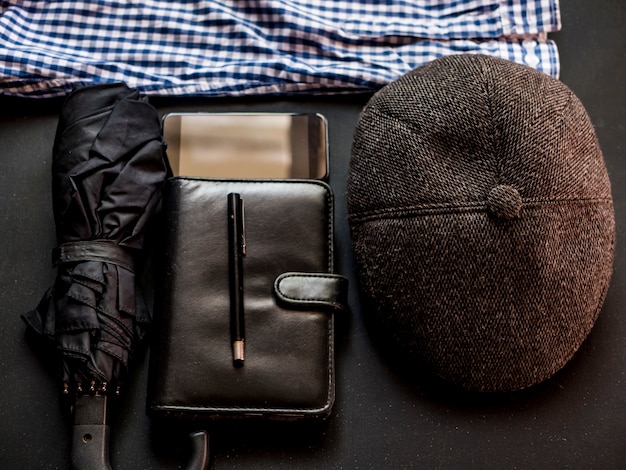 Overhead businessman working elegant man supplies on black dark table