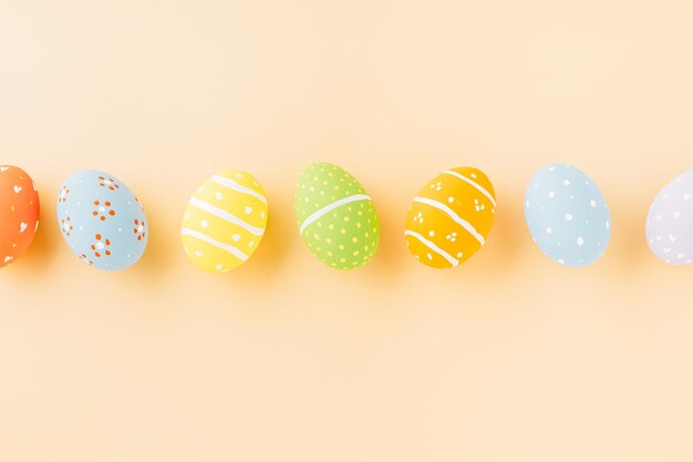 Overhead easter eggs isolated on pastel background with copy space funny decoration happy easter