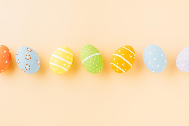 Overhead easter eggs isolated on pastel background with copy space