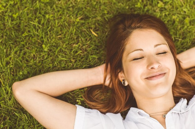 Overhead of pretty redhead smiling