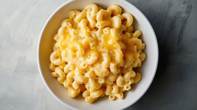 Photo overhead shot of cheese macaroni in a white bowl