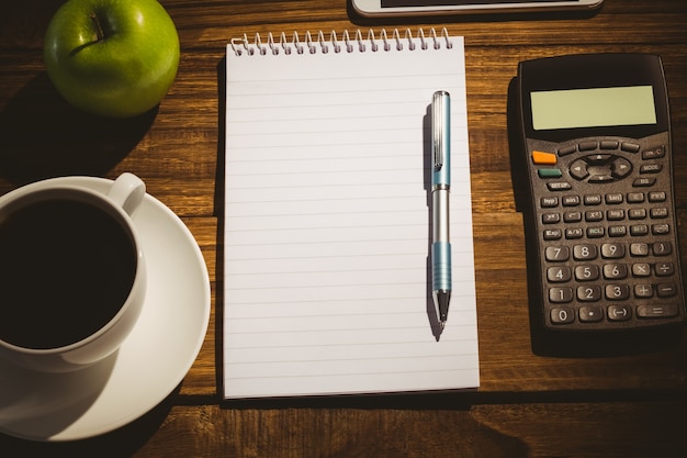 Overhead shot of notepad and calculator