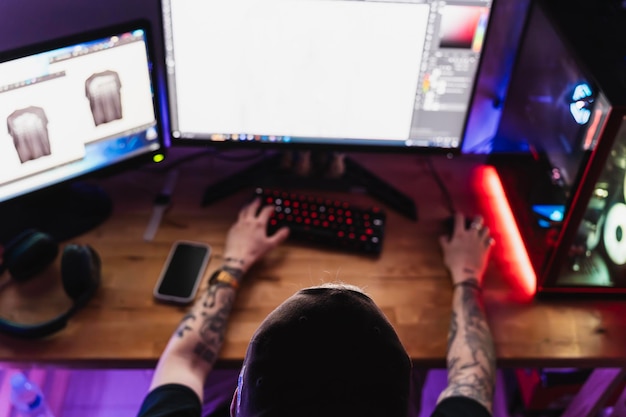 Overhead shot of an unrecognizable professional editor creating content in his home workspace