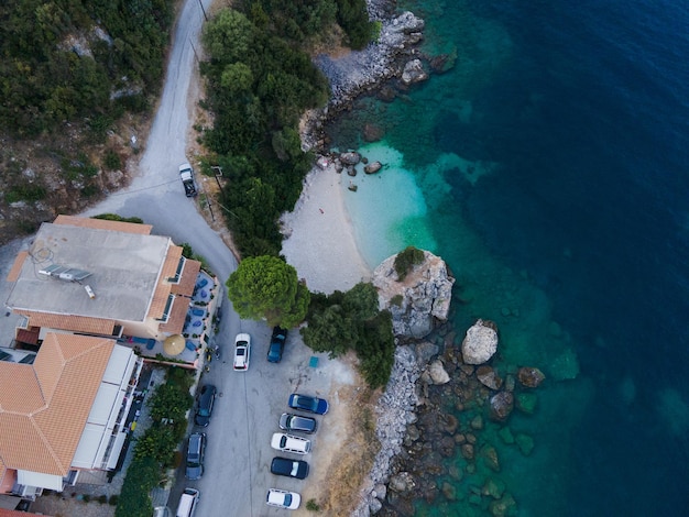 Overhead view car moving by road near sea Vasiliki town