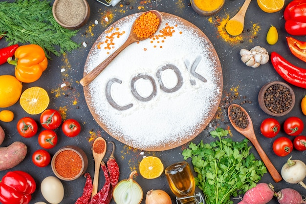 Photo overhead view of cook writing with flour