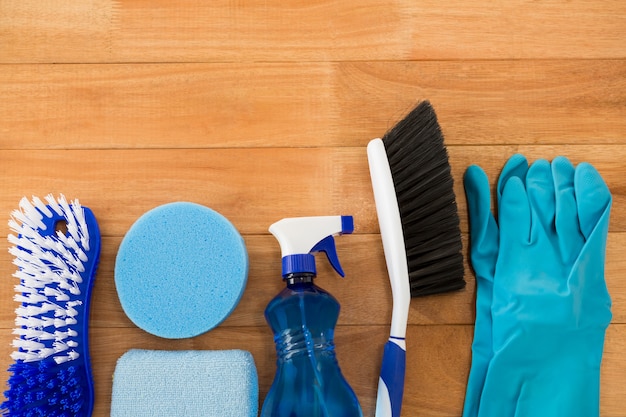 Overhead view of different cleaning equipment on table