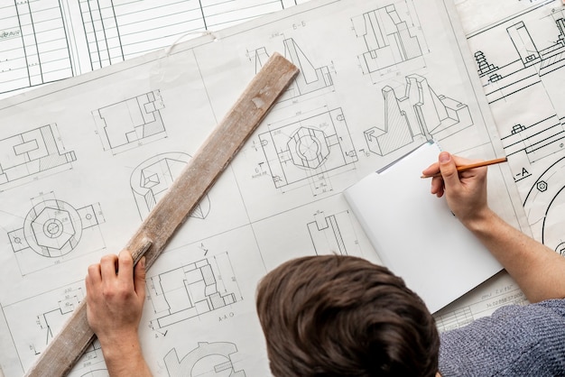 Overhead view of graphic designer draw a graph b