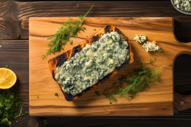 Overhead view of grilled blue cheese on cedar plank