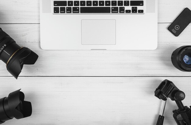 overhead view laptop with camera accessories white desk High quality and resolution beautiful photo concept