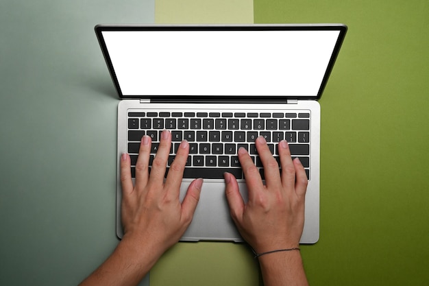 Overhead view man hand typing on laptop computer.