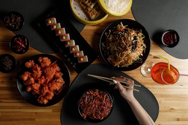 Overhead view of table with Chinese food Dark moody stock image