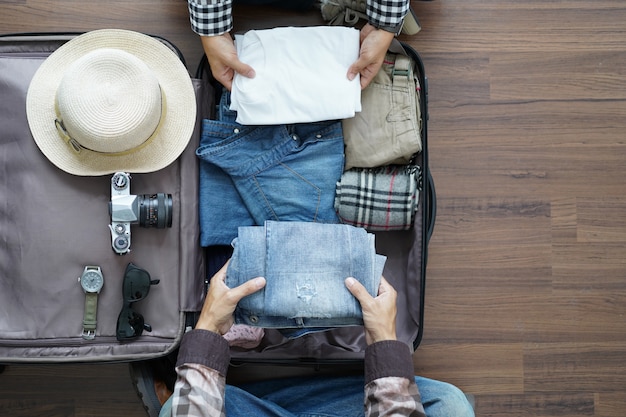 Overhead view of Traveler's Young couple planning honeymoon vacation trip