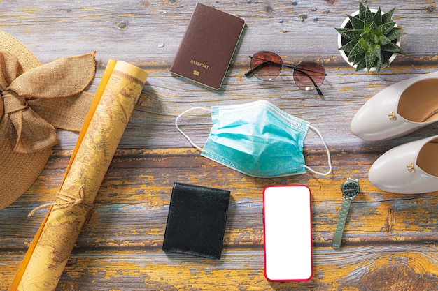 Foto vista dall'alto degli accessori dei viaggiatori articoli essenziali per le vacanze sfondo del concetto di viaggio