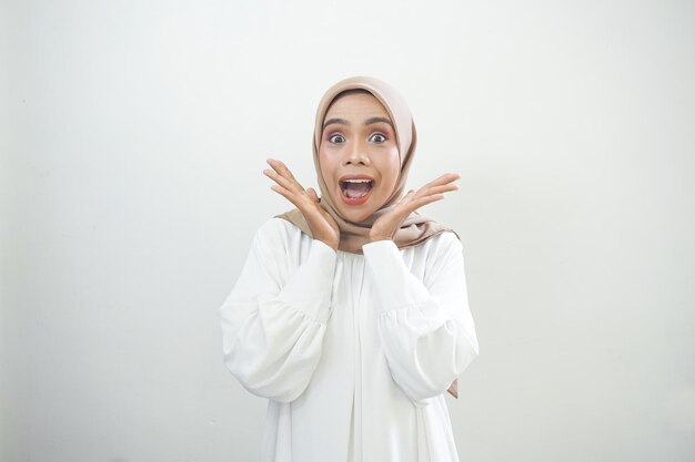 Overjoyed beautiful Asian woman in casual shirt celebrating big luck and success