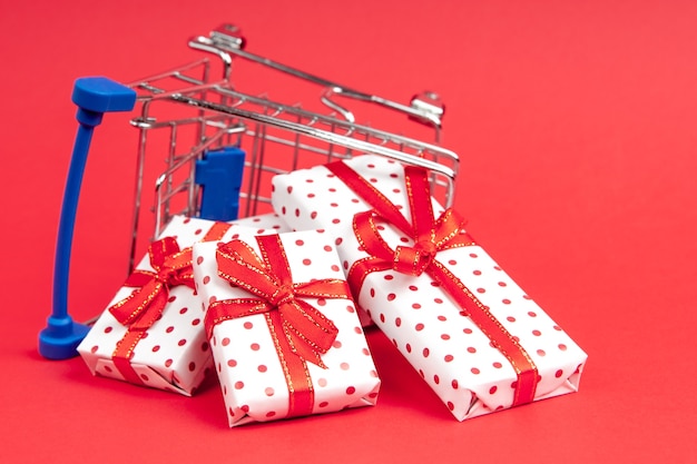 An overturned grocery cart full of gifts