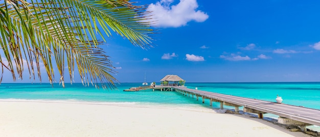 Overwater bungalow, shore coast landscape. Tropical island beach, amazing blue sky endless sea view