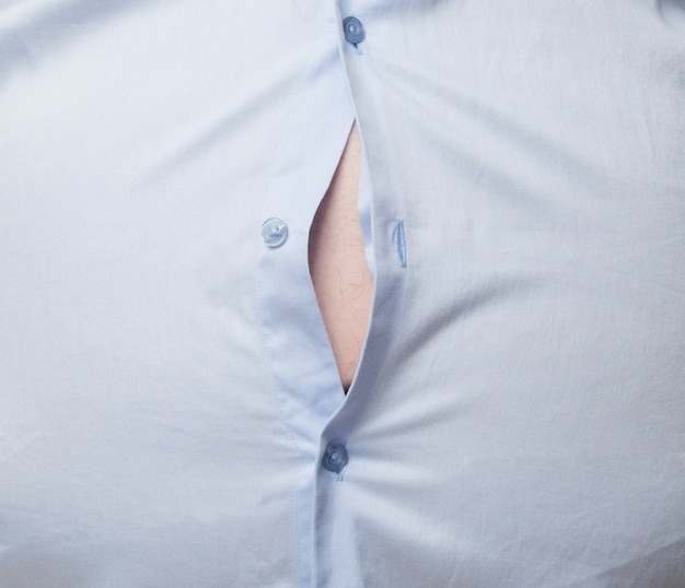 overweight man showing his belly