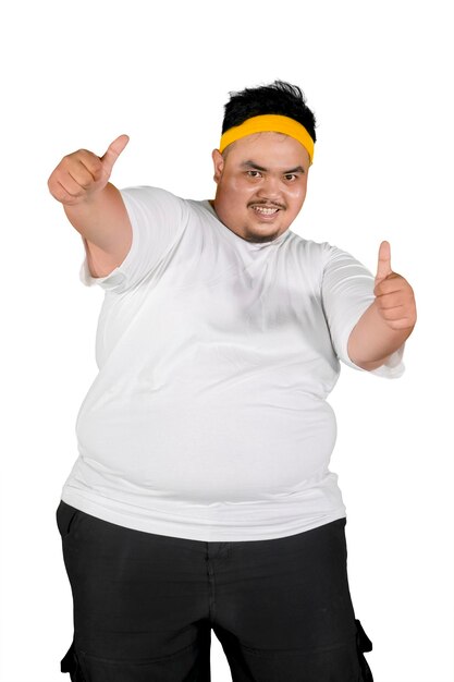 Overweight man showing thumbs up on studio