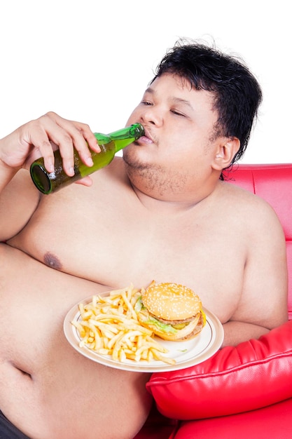 Photo overweight person enjoy burger and beer