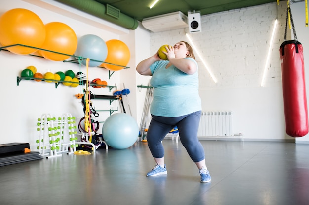 Overweight Woman Doing Squats