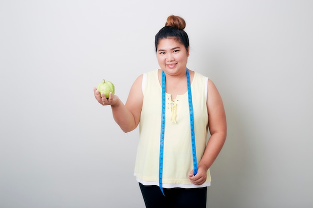 Overweight woman eating food