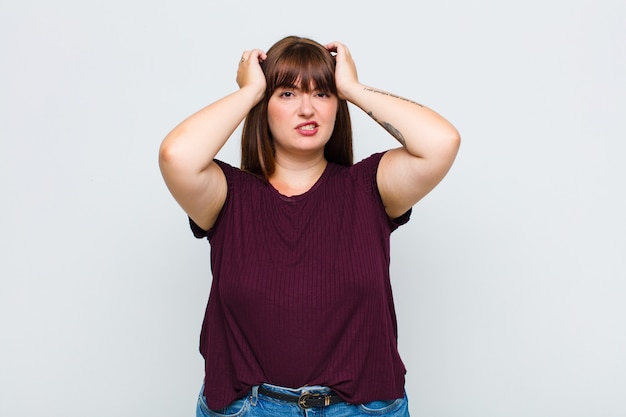 Overweight woman feeling frustrated and annoyed, sick and tired of failure, fed-up with dull, boring tasks