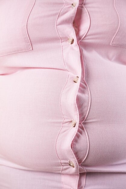 overweight woman in tight shirt closeup obesity and weight loss