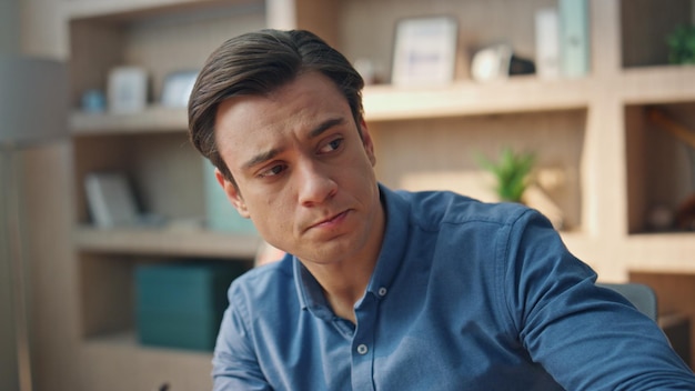 Overworked freelancer sipping coffee workplace closeup man taking eyeglasses on