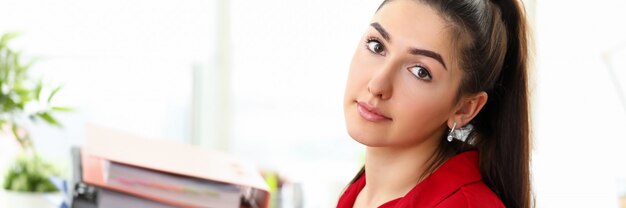 Overworked woman at workplace portrait