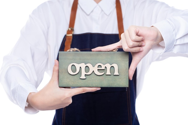 Owner person hold Open Sign Business to show service at door entrance store cafe retail and welcome shop Happy Entrepreneur female wear waitress dress as open business time again concept