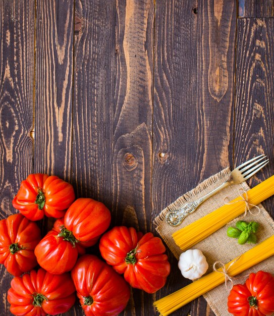 Ox heart tomatoes, on rustic wood table