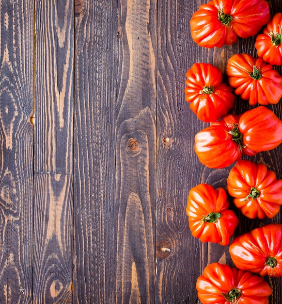 Ox heart tomatoes on wood