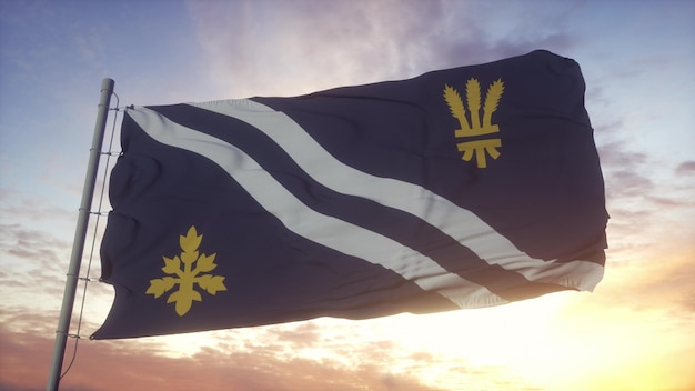 Oxfordshire flag, England, waving in the wind, sky and sun background. 3d rendering