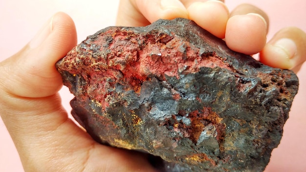 Oxidized mineral iron ore samples are black and reddish. For metal rock identification.