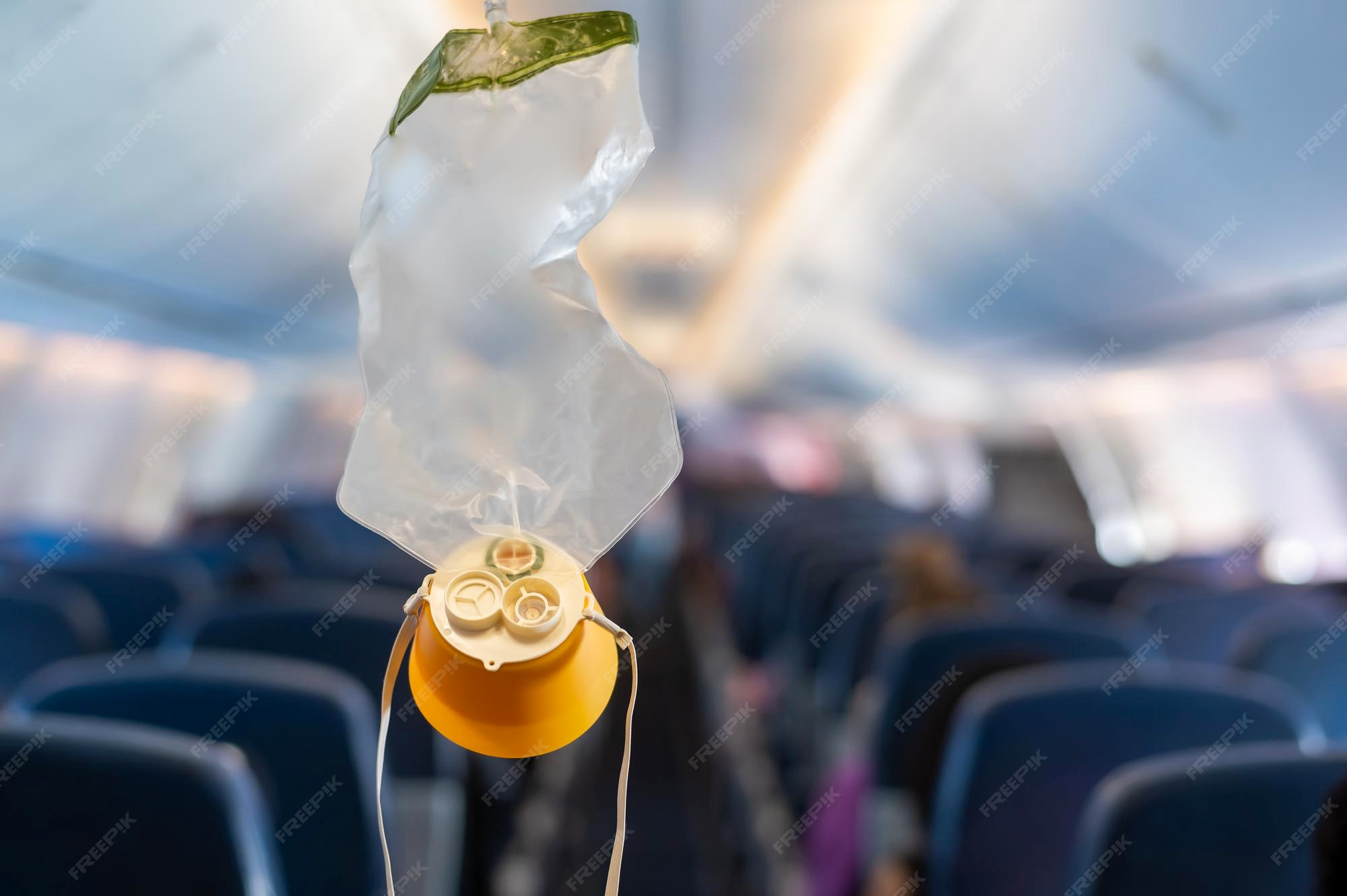 Premium Photo Oxygen mask drop from the ceiling compartment on