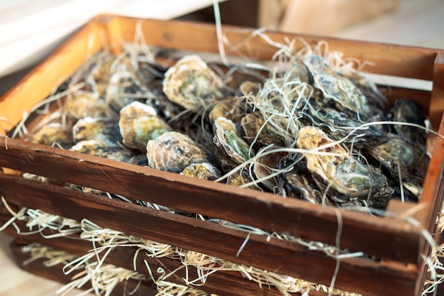 Oysters in a wooden box.