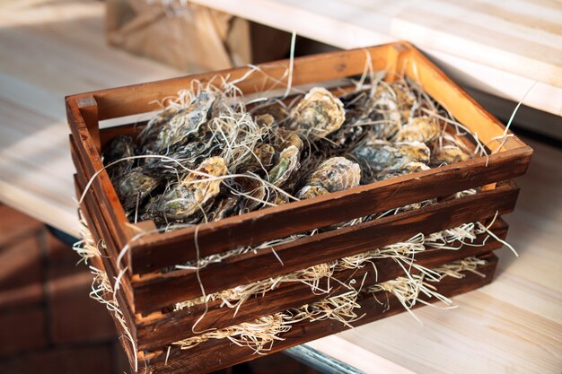 Oysters in a wooden box.