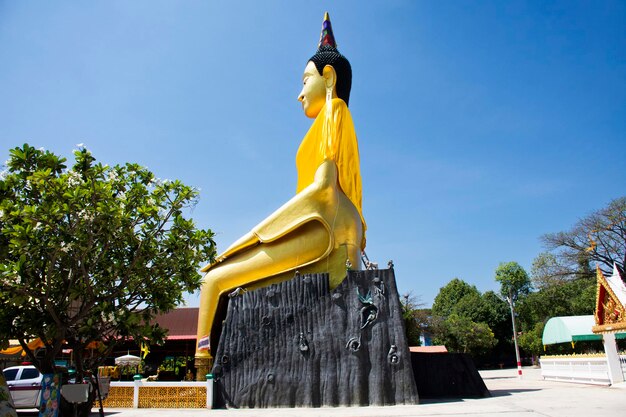 Pa Lelai buddha statue attitude or Buddha receiving food offerings from elephant and monkey for thai people respect praying at Wat See Roy or Si Roi temple at Wiset Chai Chan in Ang Thong Thailand