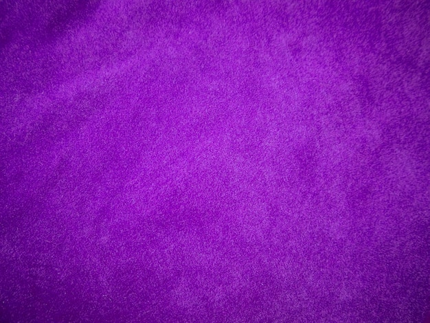 Paarse fluwelen stof textuur gebruikt als achtergrond Luxe violette stof achtergrond van zacht en glad textielmateriaal Er is ruimte voor tekst