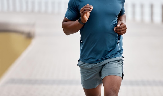 Pace yourself this is your journey Closeup shot of an unrecognisable man running outdoors