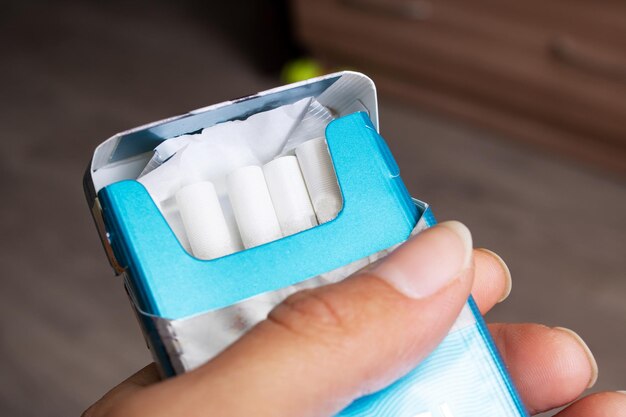 Pack of cigarettes in hand close up