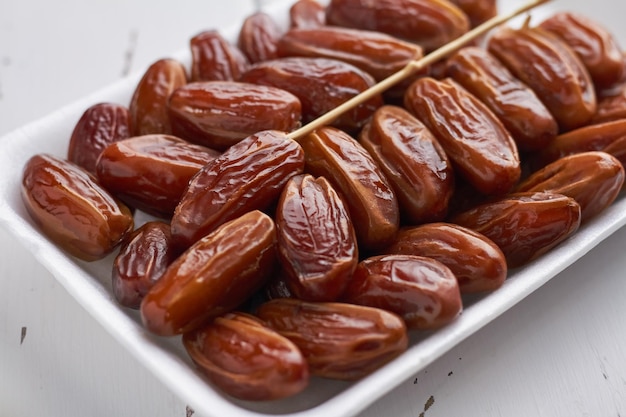 Pack of dry dates food royal dates on white background